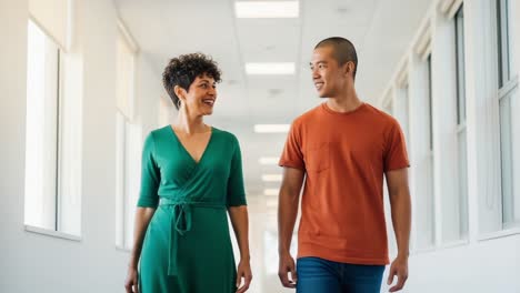 a joyful encounter: two friends walk together through a bright and inviting hallway, engaging in lively conversation and sharing smiles