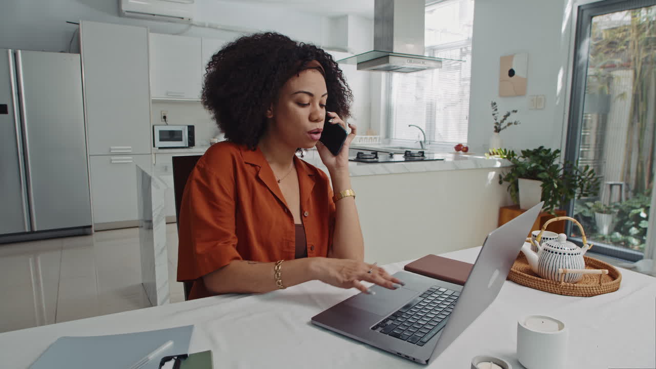 Female Manager Calling Coworker Doing Report on Laptop at Home