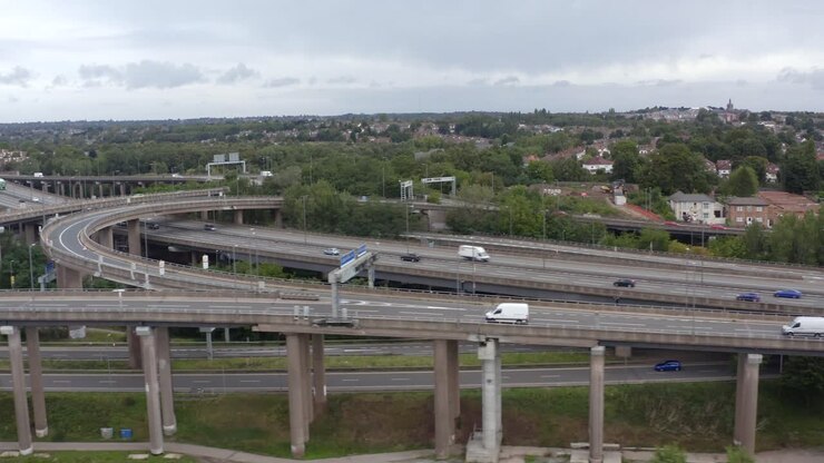 Drone Shot Tracking Train Through Industrial Estate 01
