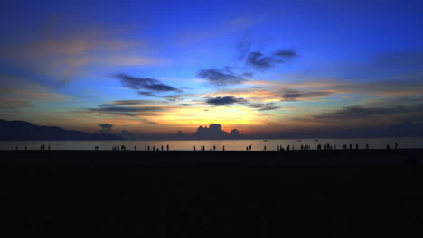 standing and looking at the sunrise in da nang in the morning.