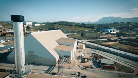 aerial shot of a production factory hangar made of metal frame