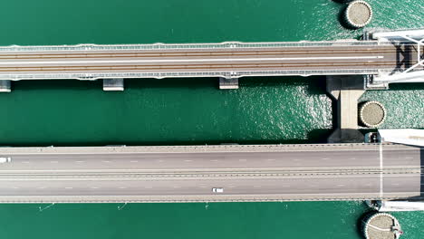 aerial view of a lift bridge over water with railway and road