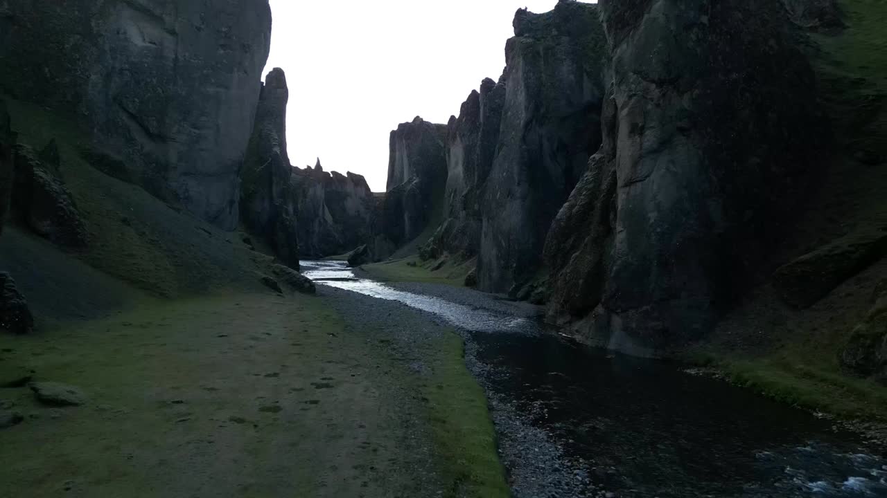 Aerial view from the the picturesque Fja&eth;r&aacute;rglj&uacute;fur Canyon in South lceland during summer, surrounded by green vegetation and rivers
