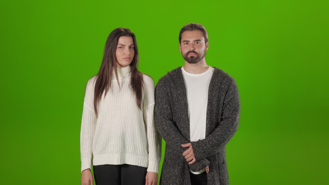 Couple looking on each other with serious facial expression