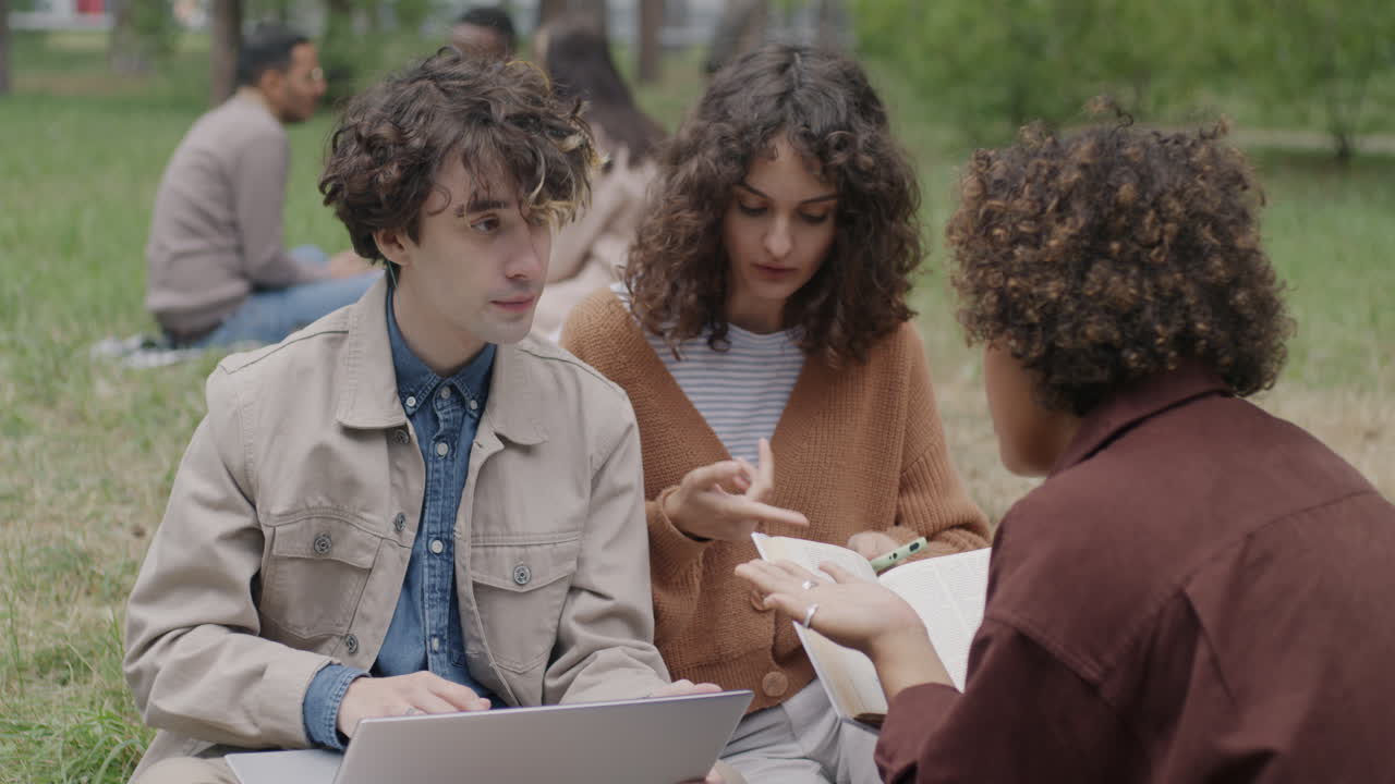 Students Studying Together in a Park