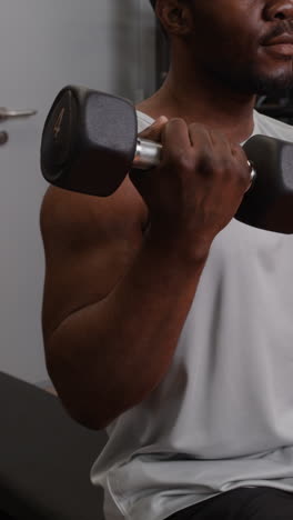man with muscular arms in gym