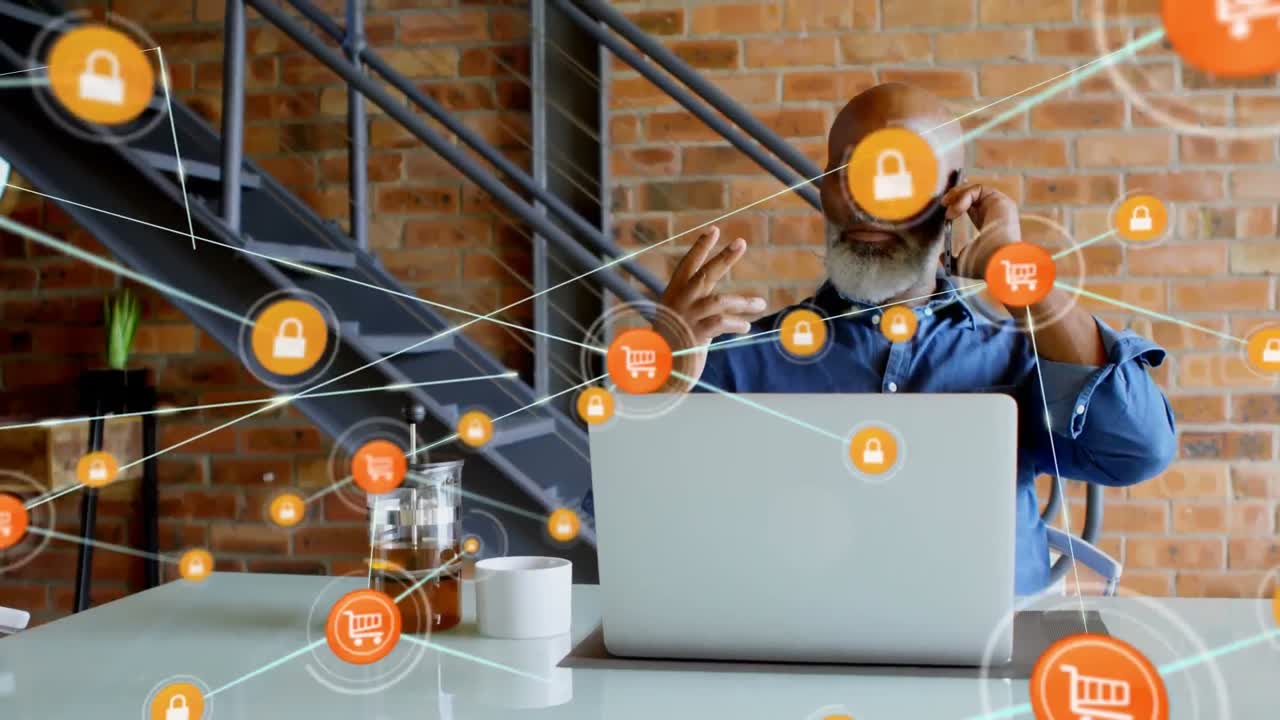 animación de una red de conexión sobre un hombre de negocios afroamericano usando un teléfono inteligente y una computadora portátil