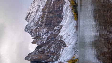 vertical 4k time lapse, pristine landscape, cold autumn morning, clouds moving above peaks