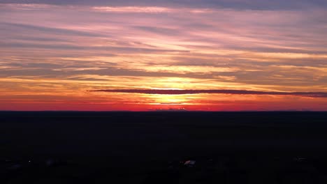 A-Mesmerizing-Sunset-Over-a-Quaint-Village-in-Black-and-Orange-Hues