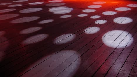 concert lighting on an empty stage, circles of light on the floor.