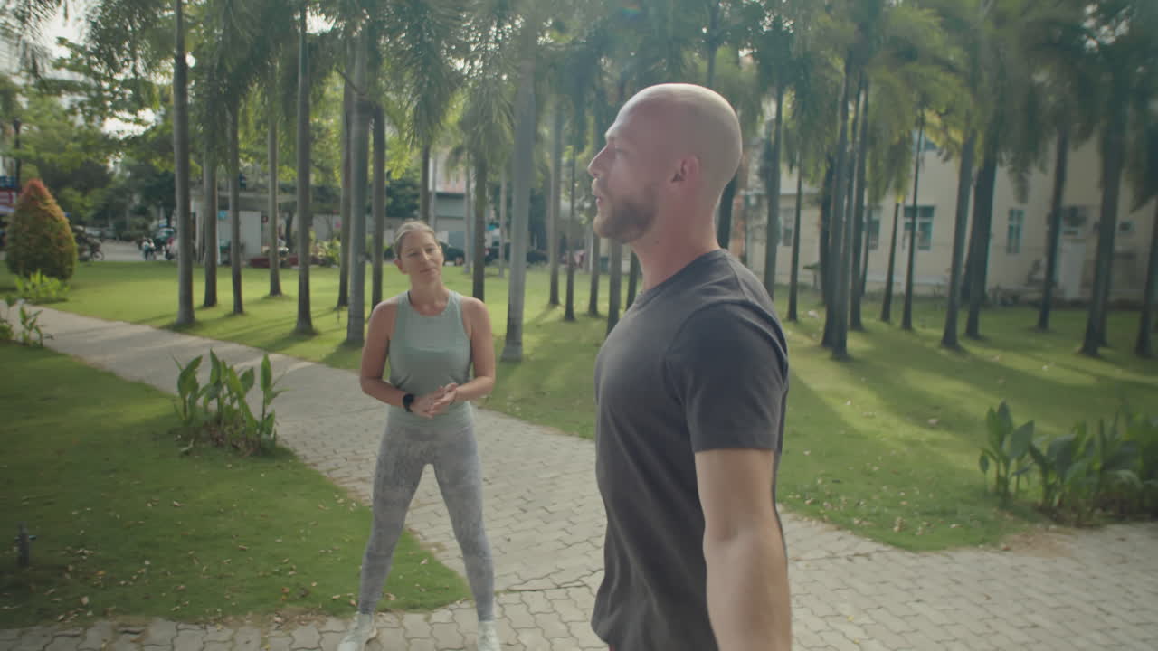 Man Jumping Rope during Workout with Female Personal Trainer