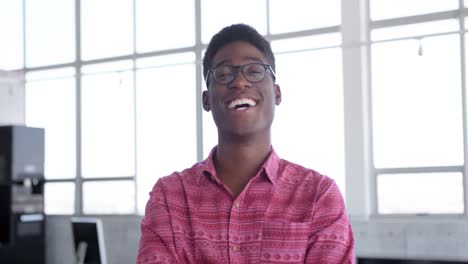 Young-handsome-African-american-male-executive-standing-in-modern-office-4k