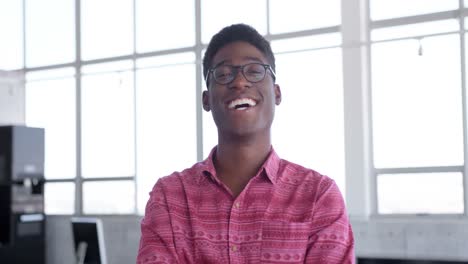 young handsome african american male executive standing in modern office 4k