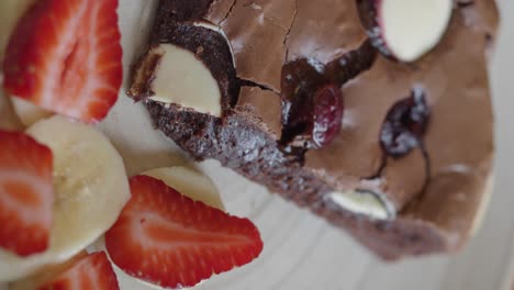 delicious brownie with strawberries and bananas