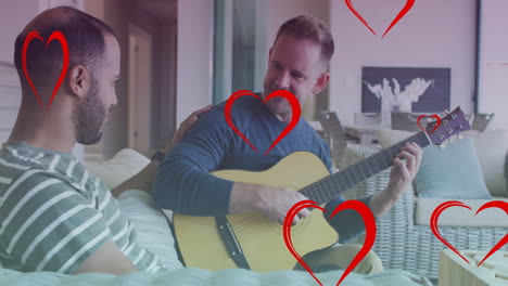 animación de iconos de corazón sobre una pareja gay diversa sonriendo y tocando la guitarra