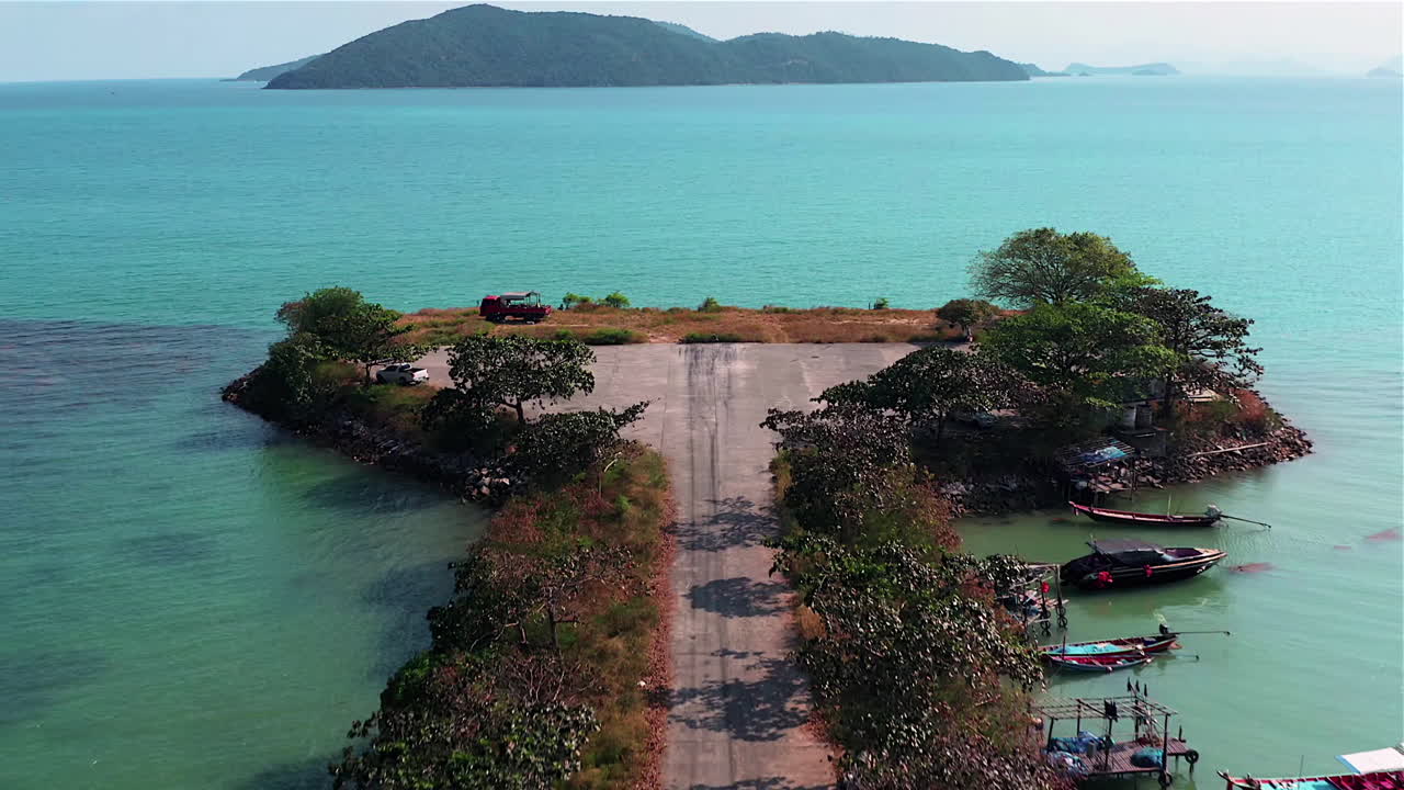 Tropical island Aerial view. Camera flies over the shore and the beach of the tropical island
