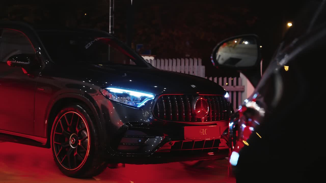 Slow reveal of brand new SUV vehicle parked during nighttime, Czechia
