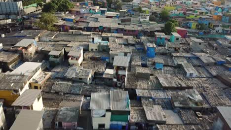 Flying-Above-Dharavi-Slum,-Poor-Residental-District-in-Overpopulated-Mumbai-City,-India