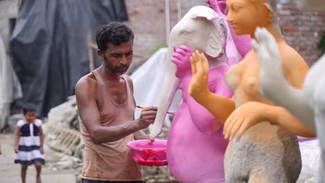 in kumortuli, idol artists are making idols of durga, the revered deity of hinduism. the work of making these idols starts from june and these potters make many idols till november.