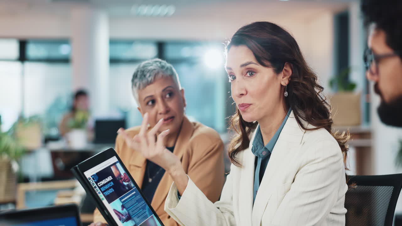 Businesswoman Presenting to Team in Office