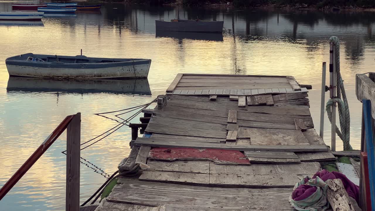 Old Wooden Dock and Boats at Sunset