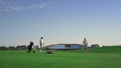 professionals golf group play sport game on field. business couple enjoy sunset.