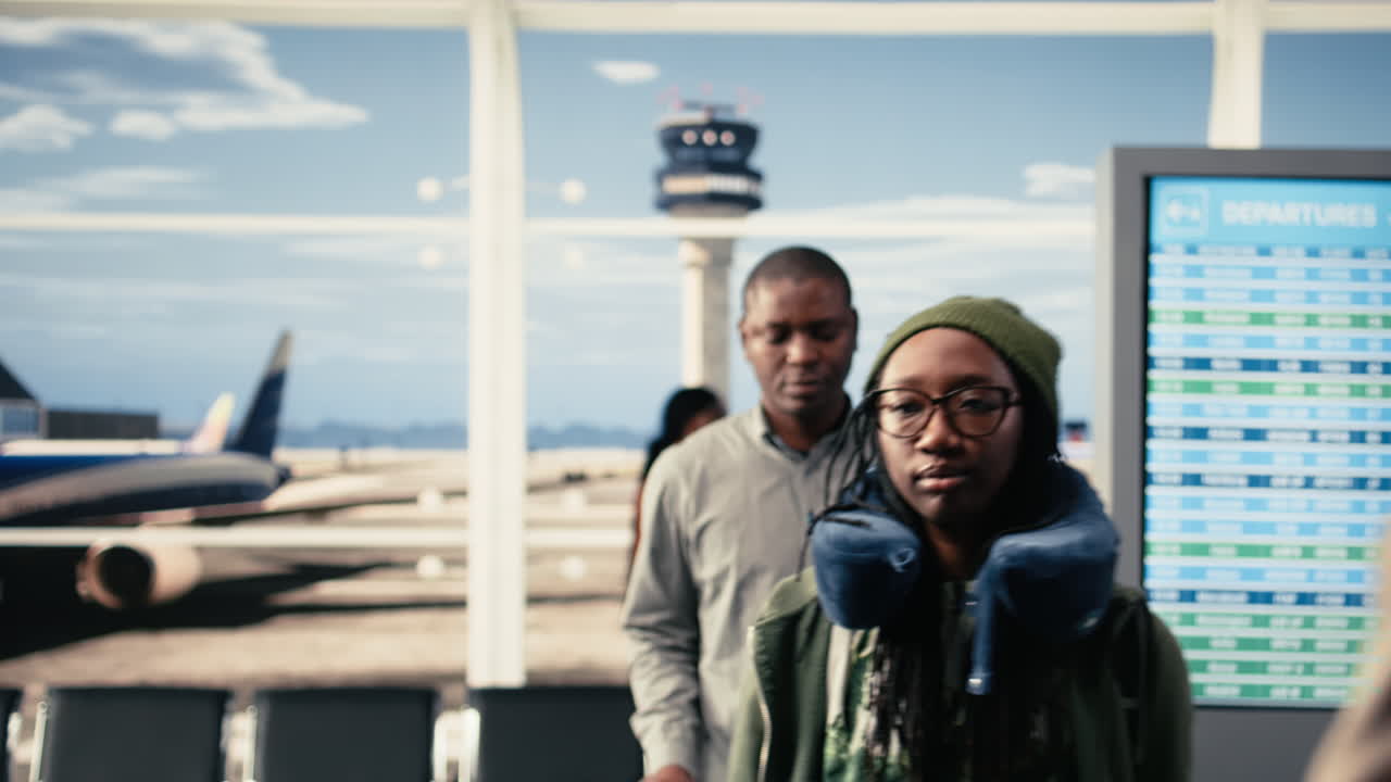 Group of tourists, business travelers, walking around, in airport terminal