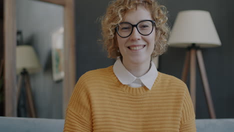 woman smiling in a cozy living room