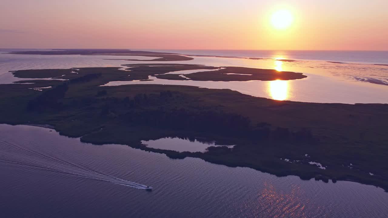 sunset at the sea, ocean, shore, oceanside, amazing view of the motorboat driving thru the bay