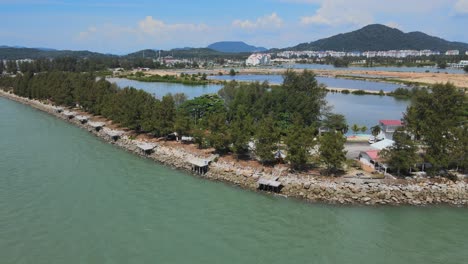 tilt down shot of seafront cafe in marina island, malaysia