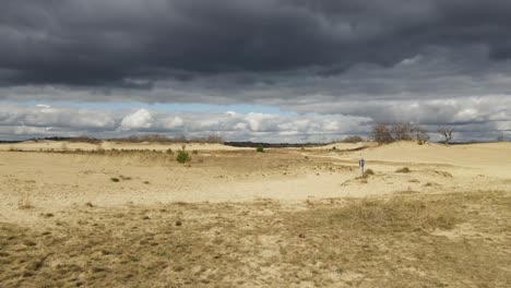 flying a drone in the dunes with a menacing sky in the background