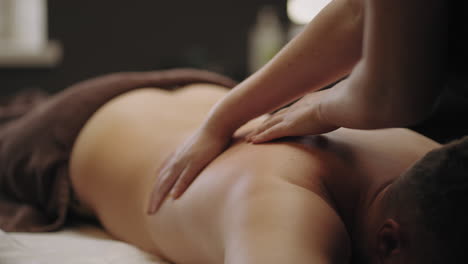 chiropractor is curing back of male patient in osteopathic clinic relax and enjoy massage treatment