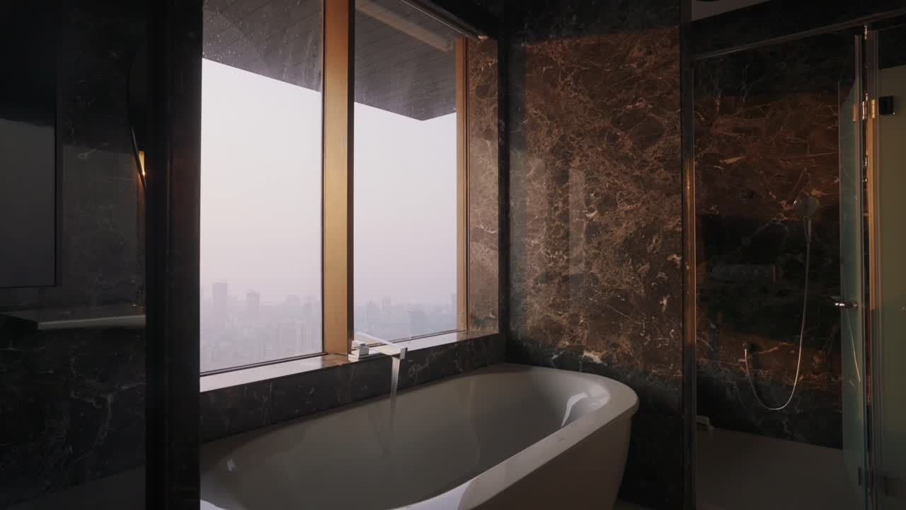 Luxurious Bathroom With White Bathtub And Elegant Marble Wall Pattern Design. - ascend shot