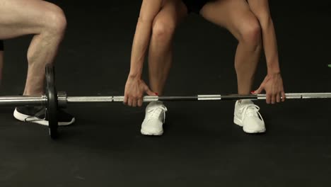 fit woman exercising with barbell