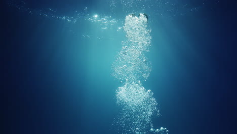 underwater sunlight beams shining from above coming through the deep crystal clear blue water causing a beautiful water lighting reflections curtain with air bubbles rising up to the surface