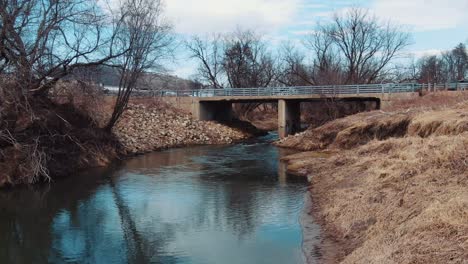 an old bridge crossing over a small creek