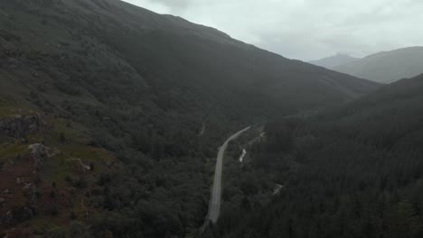 aerial footage over the rest and be thankful pass in the arrochar alps. the arrochar alps are a group of mountains located around the head of loch long, loch fyne, and loch goil, scotland, uk