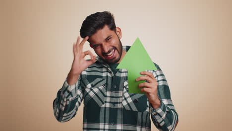 indian man winner holding arrow sign pointing up career growth and money increase good progress