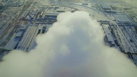 industrial complex in winter with dense smoke