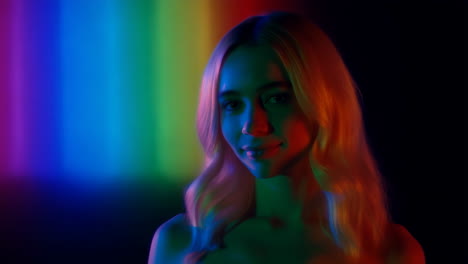 portrait of a woman with rainbow lighting