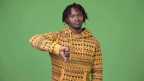 young handsome african man giving thumbs down