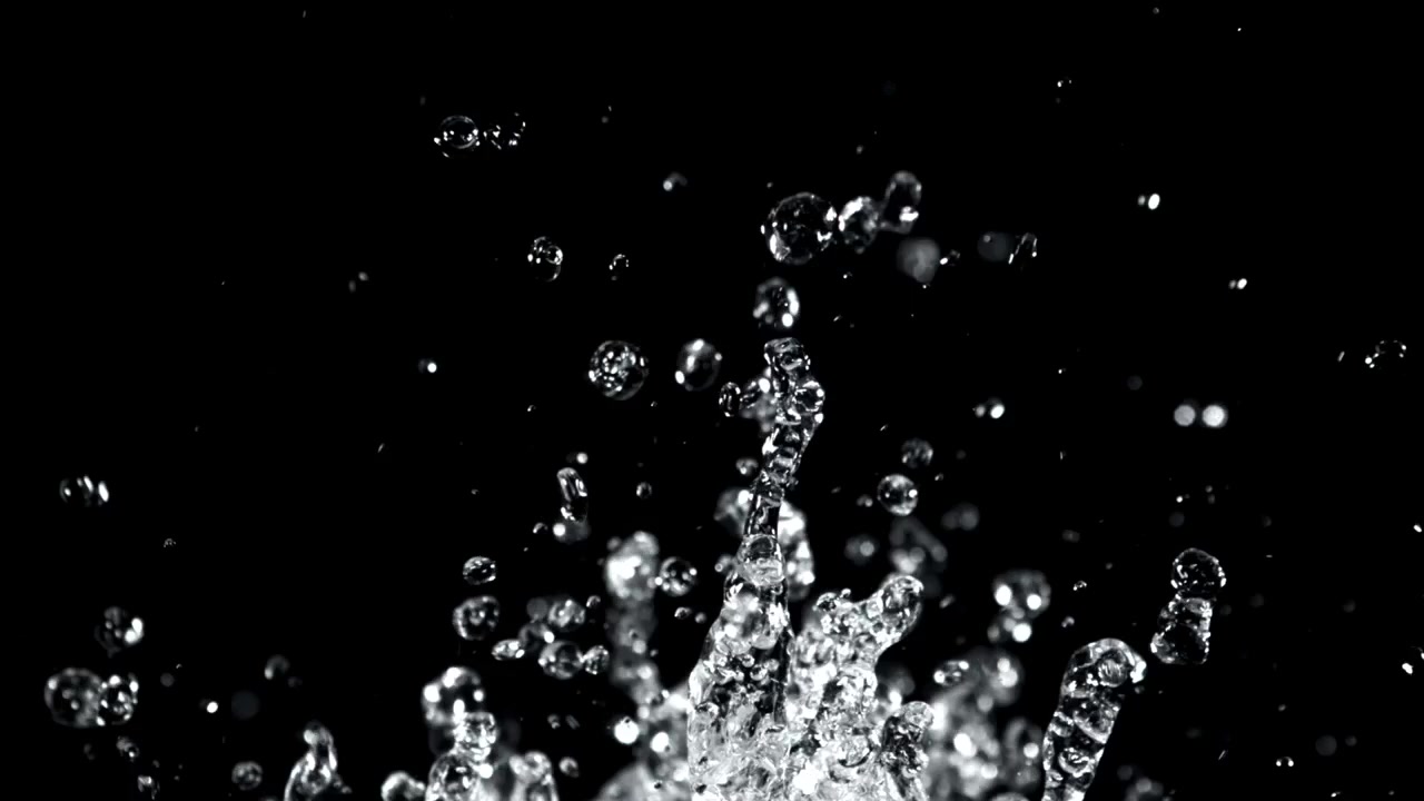 Slow Motion Water Splash and Droplets on Black Background