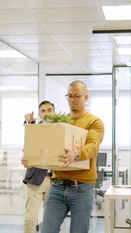 boss directs the exit to a dismissed employee