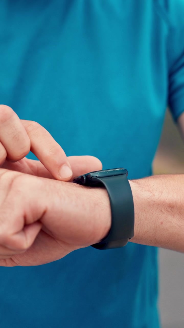 Runner Checking Smartwatch During Workout