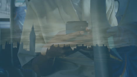 woman using smartphone and cityscape