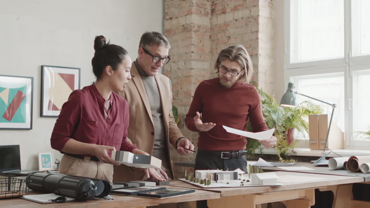 Architects Discussing Two Floor House Project Plan