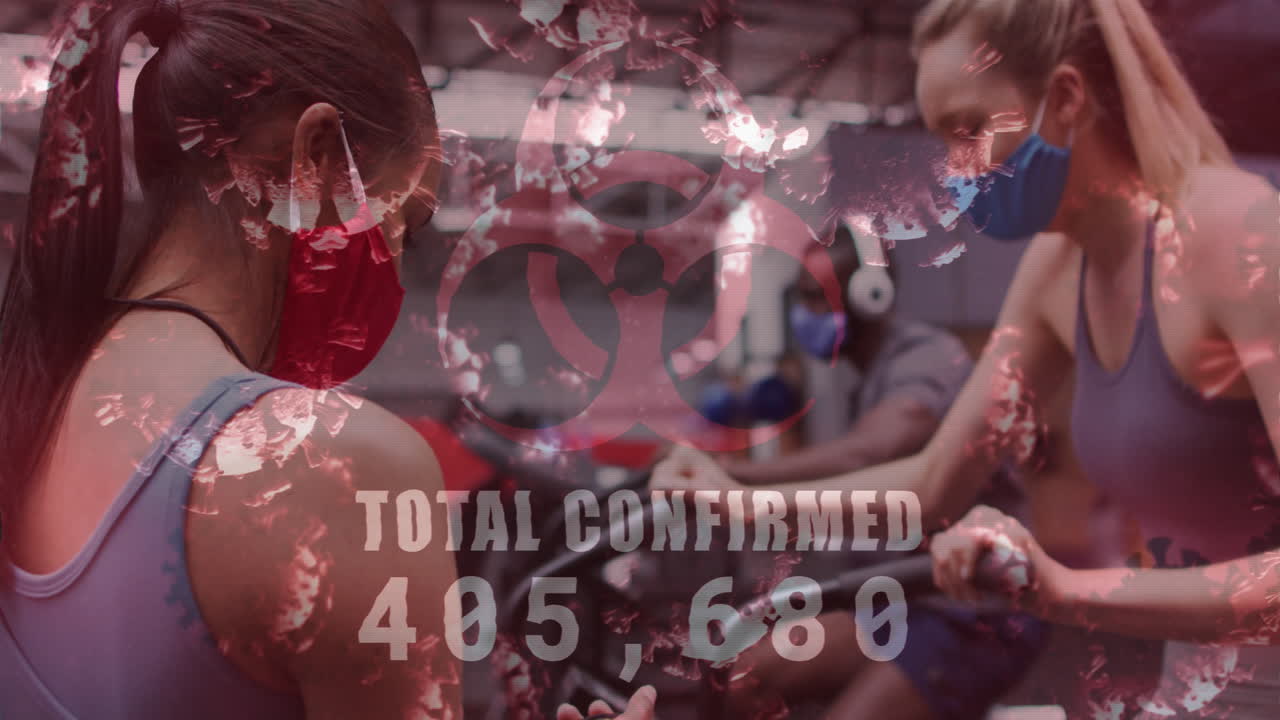 animación de células de covid-19 flotando sobre diversos grupos que usan máscaras faciales trabajando