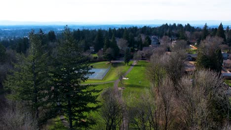 4k aerial drone shot gliding into a public park in portland, oregon