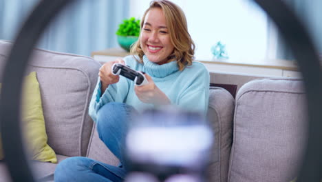 Gaming,-entertainment-and-woman-gamer-on-a-sofa