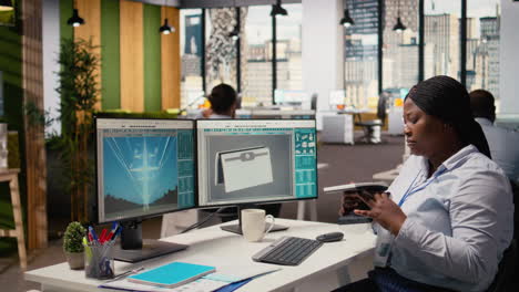 Product Developer In Office Using Solar Cell To Create Renewable Energy Device